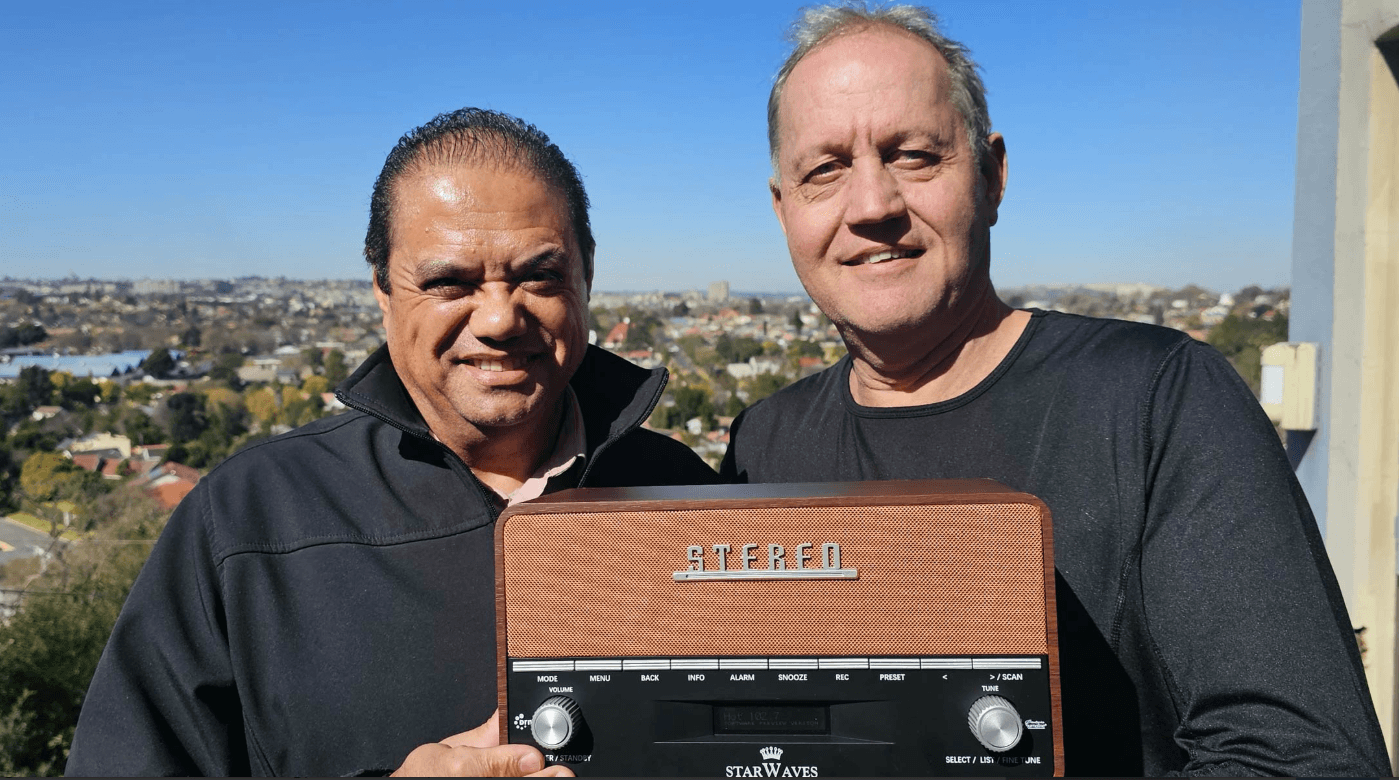 DRM SA engineers with a Starwaves DRM receiver overlooking Johannesburg